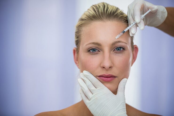 female patient receiving botox injection forehead 107420 74095 female patient receiving botox injection forehead 107420 74095