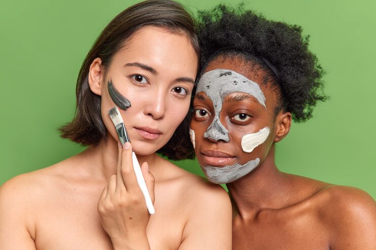 portrait diverse young women look seriously camera apply clay mask use cosmetic brush stand topless 273609 52628 portrait diverse young women look seriously camera apply clay mask use cosmetic brush stand topless 273609 52628